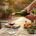 Red wine poured through the Chill Wand on a sunlit summer terrace